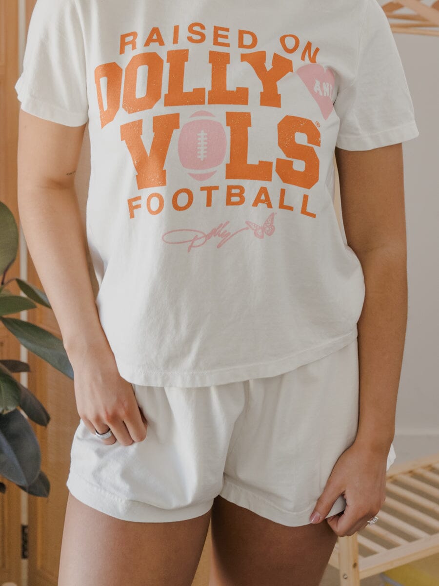 Raised on Dolly Parton & TN Vols Pink Football Natural Ellie Heavyweight Tee