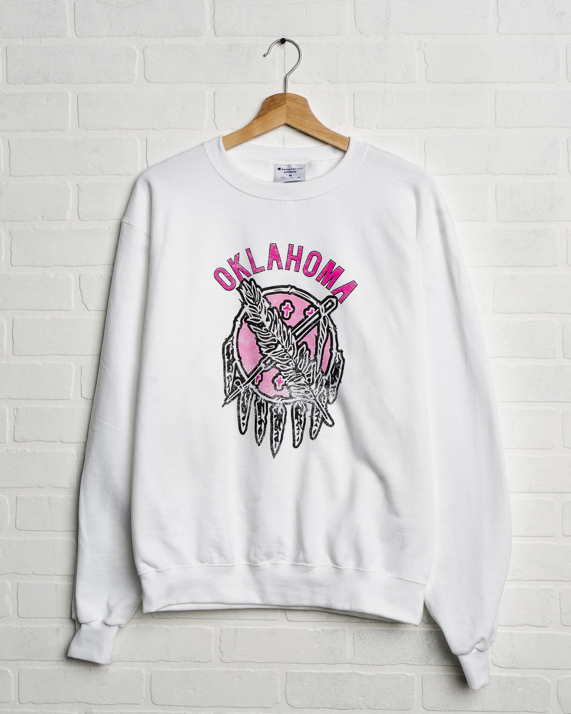 Oklahoma Sticker Shield White Sweatshirt with Pink Letters - shoplivylu